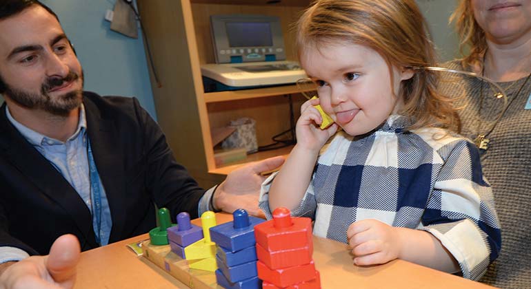 Little girl playing with toys