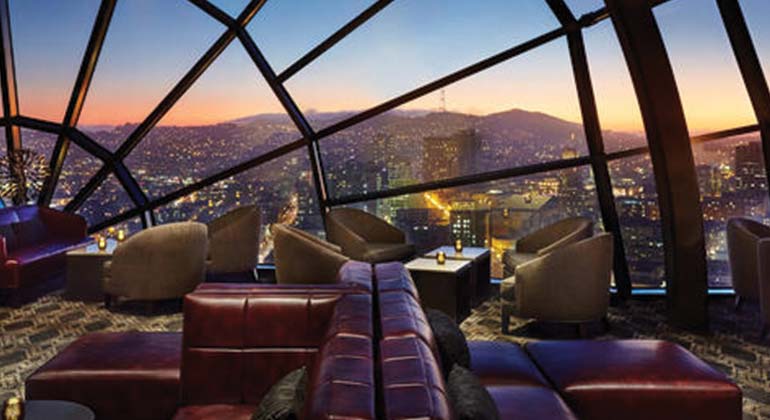 Event space overlooking city at dusk