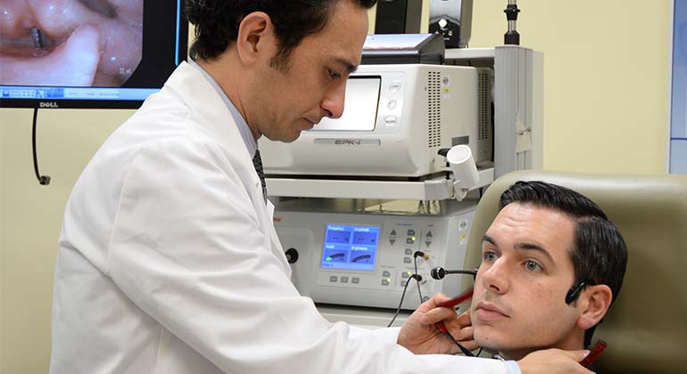 Voice and Swallowing Physician Treating Patient Grabscheid Voice and Swallowing Center at the New York Eye and Ear Infirmary