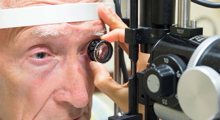 Image of doctor performing eye test on a male patient
