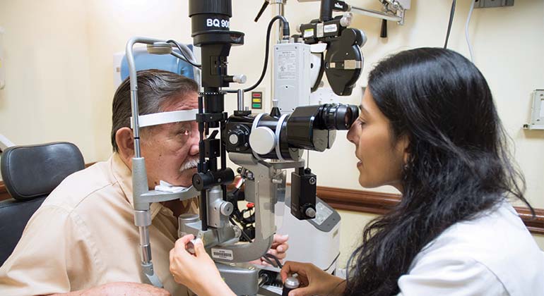 Image of doctor examining patient