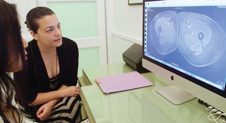 Image of female doctors looking at computer screen