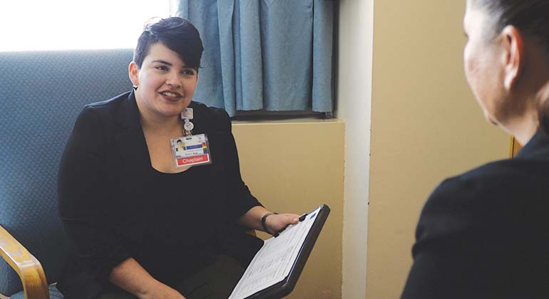 Chaplin speaking to patient