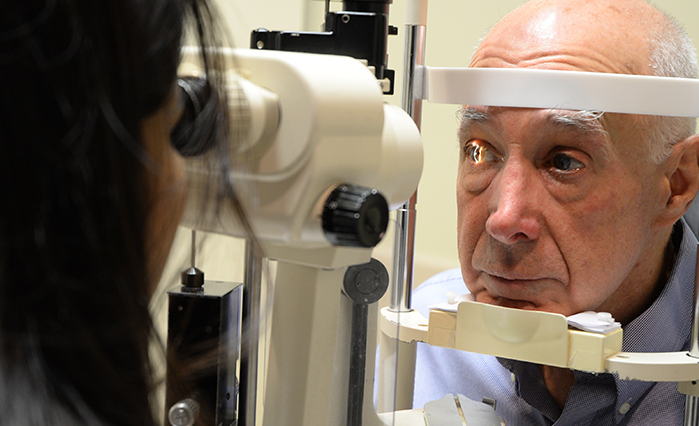 Patient having eyes examined by doctor