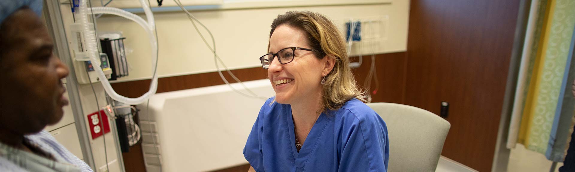 Image of nurse talking to patient