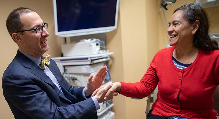 Doctor shaking hands with female patient
