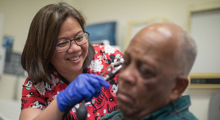 doctor examining patient