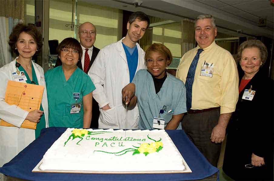 PACU staff with cake